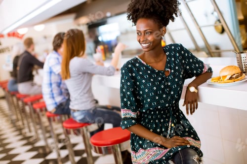 Preview: Young african american woman in the diner