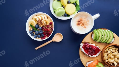 Vista previa: breakfast top view black background. oatmeal with berries, toasts on a wooden tray, nuts, coffee