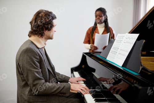 Preview: Teacher teaching a Music lesson to a student
