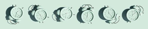Preview: Top view of creative pattern made of red alarm clocks on a blue background, banner