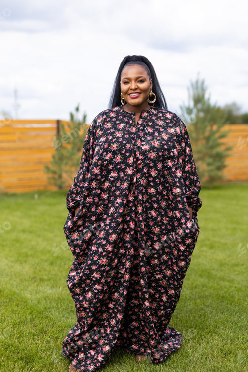 Preview: Summer portrait of beautiful african american woman in colourful dress wear standing on backyard