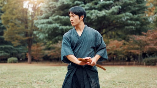 Preview: Nature, training and Asian man with bamboo sword in park for martial arts, Kendo practice and exerc