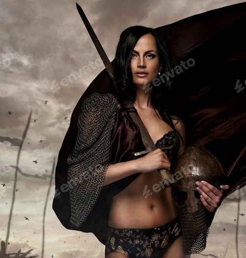 Preview: Sexy brunette female in a war queen costume.