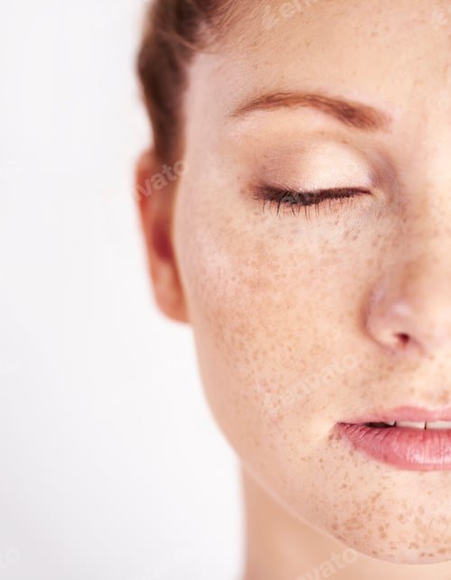 Preview: Half of woman's face with freckle