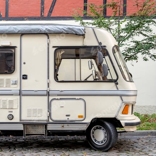 Preview: Old vintage motor home parked on city street