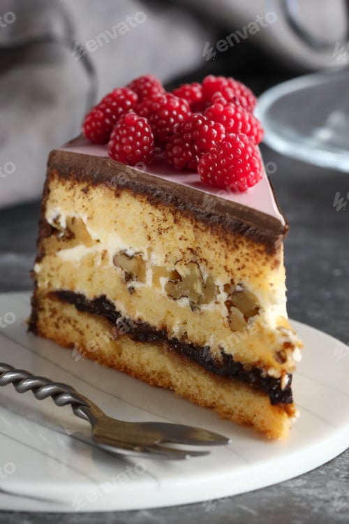 Preview: piece of cake on a plate with fresh berries for dessert