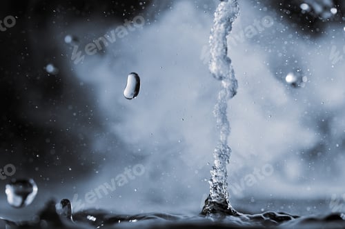 Preview: Boiling water splash with steam on black background closeup