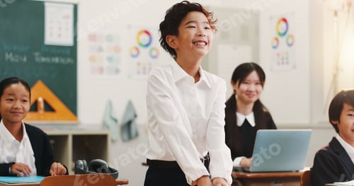 Preview: Smile, student and japanese child in classroom with learning, education and youth knowledge at scho