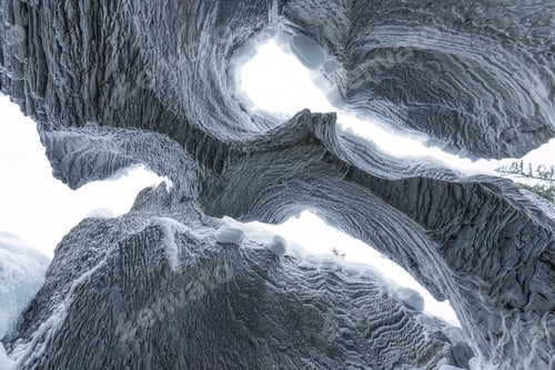 Preview: Ice cave with rock formation of water eroded on winter