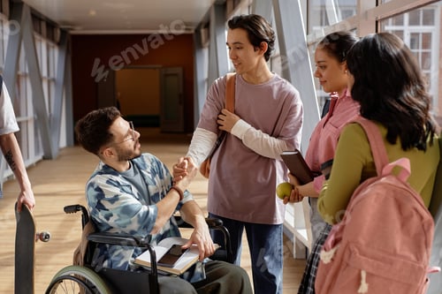 Preview: Student Using Wheelchair Greeting Classmate with Handshake