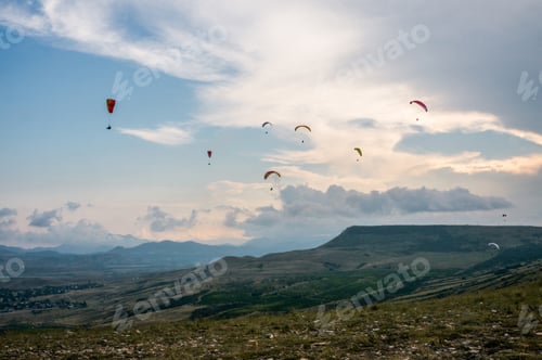 Preview: people flying on paraplanes sky with clouds on background, Ukraine, Crimea, may 2017