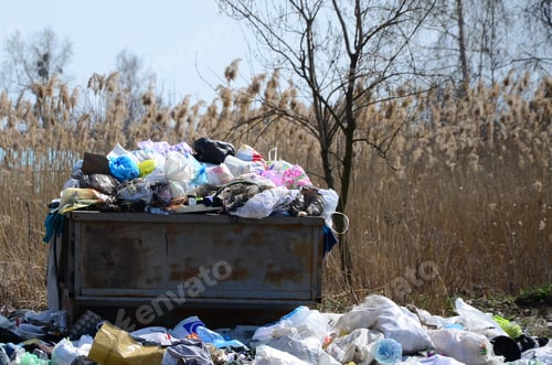 Preview: The garbage can is packed with garbage and waste. Untimely removal of garbage in populated areas
