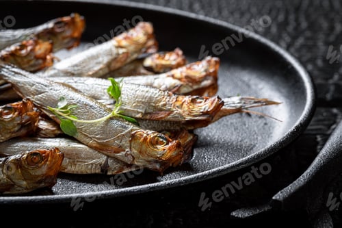 Preview: Fresh smoked sprats with herbs and salt.