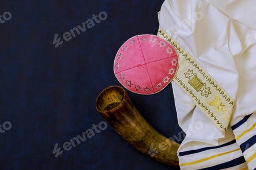 Preview: An Orthodox Jewish holiday symbol consists of prayer shawl tallit, a kippah head covering