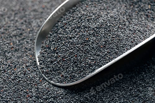 Preview: Poppy seeds and metal scoop, closeup view