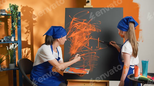 Preview: Mom and child learning to paint with orange aquarelle color