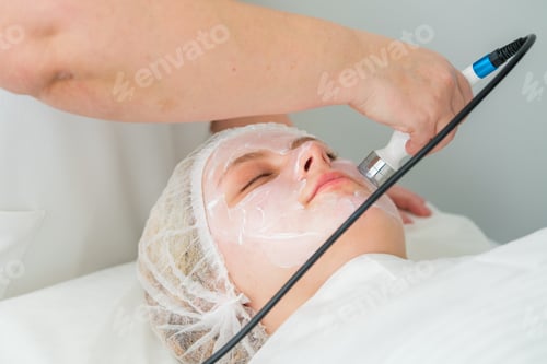 Preview: Client experiencing RF lifting treatment for skin rejuvenation in beauty clinic