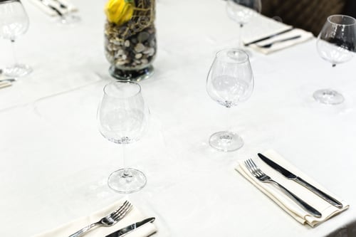 Preview: close up of table setting with glasses and cutlery
