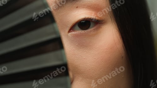 Preview: Dark eyes Asian woman looking at camera korean chinese japanese lady female girl hiding face with