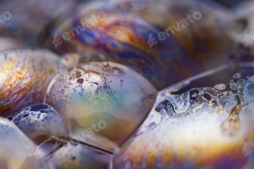 Preview: Abstract texture with bubbles. Rainbow soap bubble on a black background.