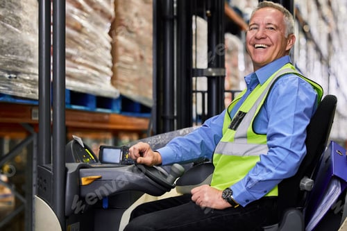 Preview: I paid the cost to be the boss. Shot of a mature man working on a forklift in a warehouse.