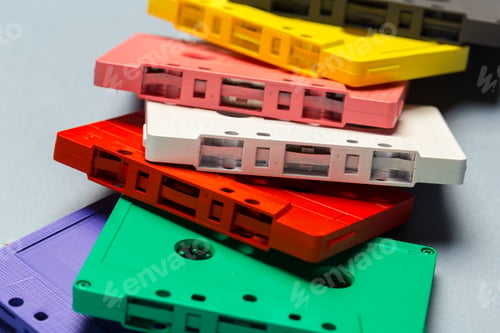 Preview: Bright retro cassette tapes on a light grey background