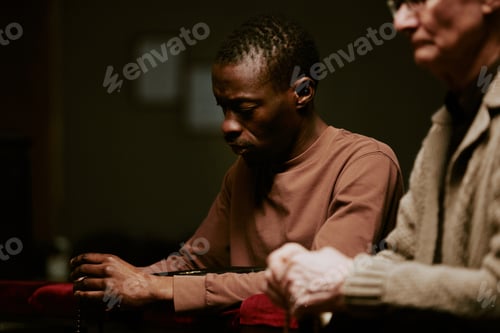 Preview: Two Male Parishioners In Church