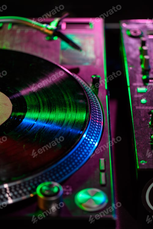 Preview: close up view of sound mixer with vinyl in nightclub