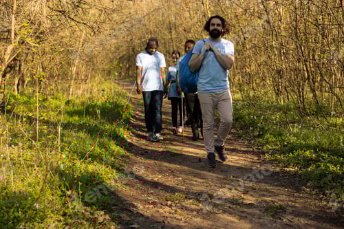 Preview: Motivated team of volunteers finishing garbage cleaning mission in the woods