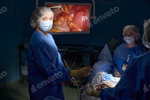 Preview: Surgeons Performing Laparoscopic Surgery in Operating Room