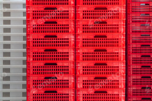 Preview: Red and white professional boxes for merchandise stored on a factory warehouse