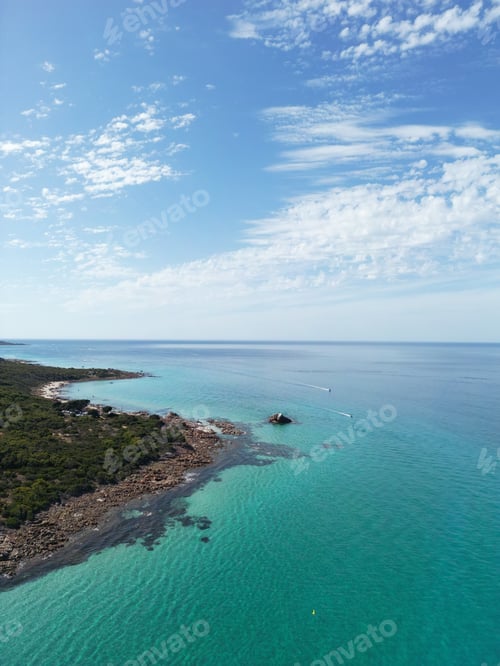 Preview: Aerial view of a tropical beach coastline with crystal clear blue waters