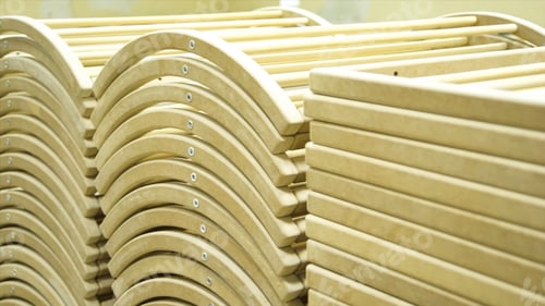 Preview: Close-up of a Carpenter working on a Wooden Window Frame with a File in his Workshop. Stock