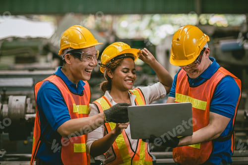 Preview: happy laugh engineer man and woman team enjoy working together talking using laptop computer