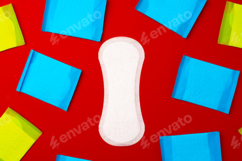 Preview: Pile of woman pads on red background