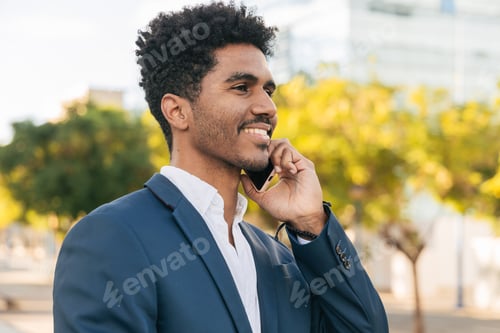 Preview: Cheerful Adult Man Talking on Phone Outdoors