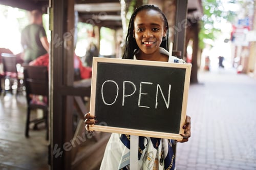 Preview: African american woman hold open welcome sign board