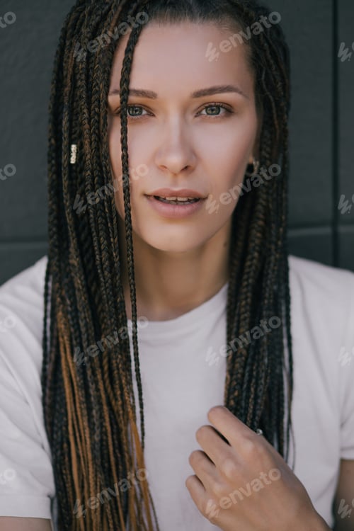 Preview: Portrait of young beautiful woman with braids