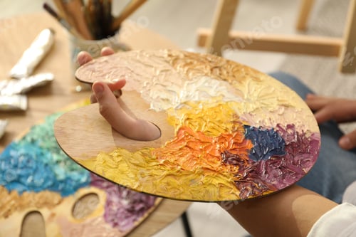 Preview: Close-up of Artist Holding Colorful Paint Palette