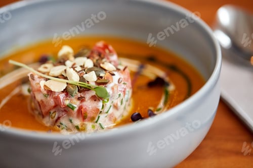 Preview: close up of vegetable pumpkin-ginger soup in bowl