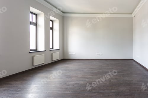 Preview: Side view of unfurnished room loft interior with wooden floor, white walls with bright daylight