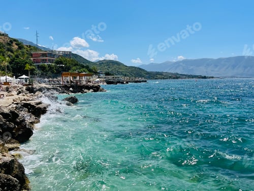 Preview: Rocky beach and crystal turquoise water of Ionian Sea in Albania.