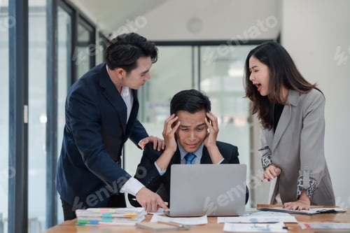 Preview: Business team in office environment experiencing stress and conflict, with a frustrated man