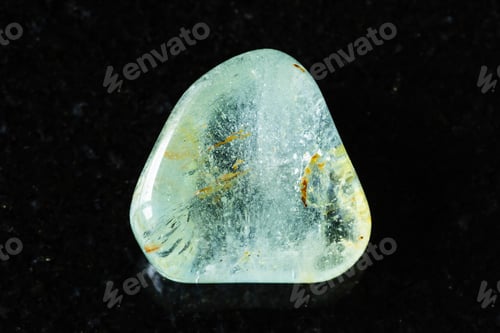 Preview: sample of tumbled blue topaz mineral on black
