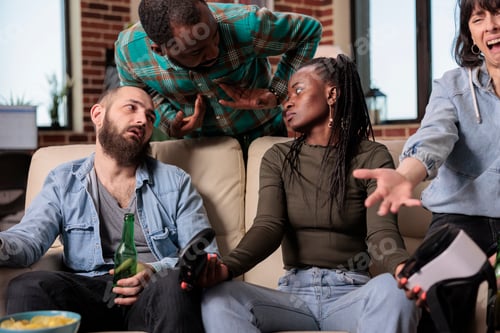 Preview: Multiethnic group of friends winning video games with vr goggles