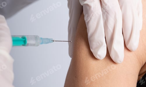 Preview: Selective focus shot of a vaccine injection process
