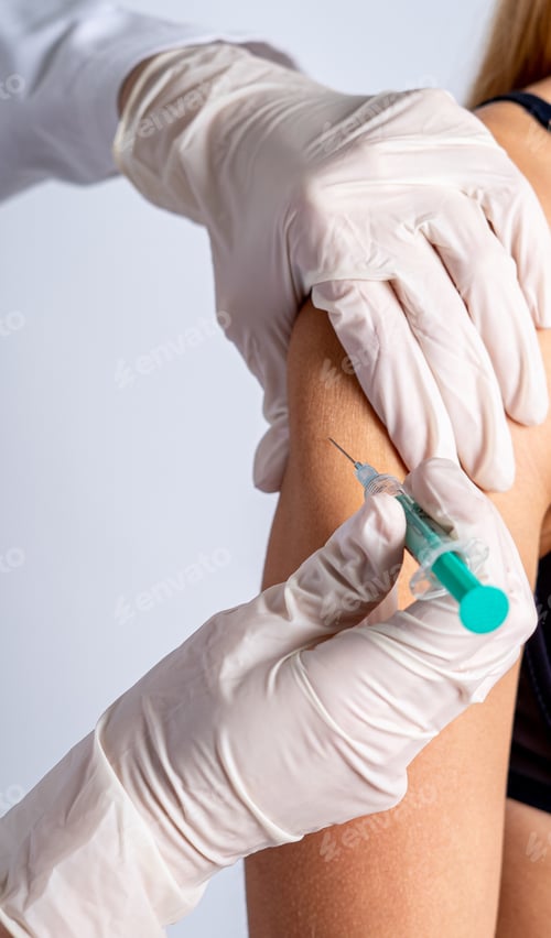 Preview: Selective focus shot of a vaccine injection process