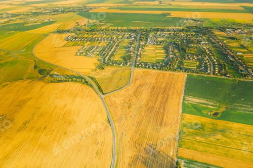 Preview: Aerial View Of Village And Hay Rolls, Straw Field Landscape In Summer Evening. Haystack, Hay Roll in