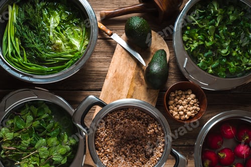 Preview: Buckwheat, red radish, herbs in a bowl of water on the table
