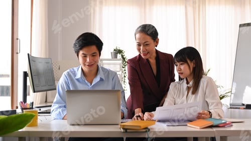 Preview: Image of developer team collaborating on mobile application software design project together